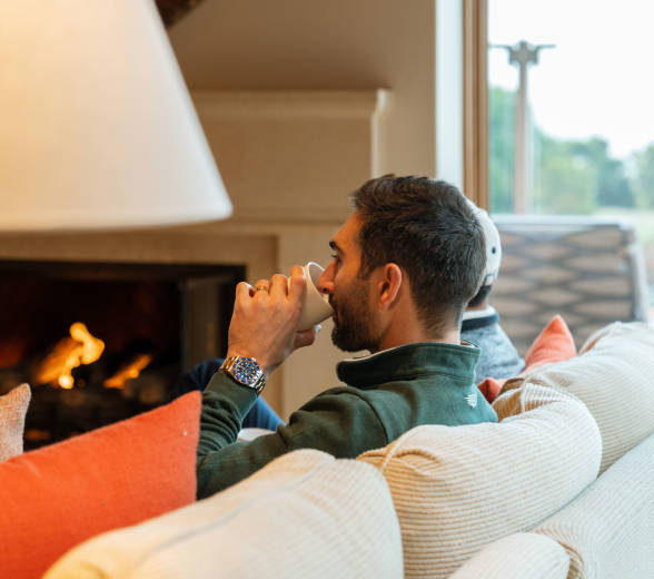 Man drinking coffee in Villa