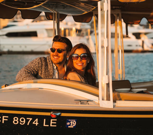 Couple on duffy boat