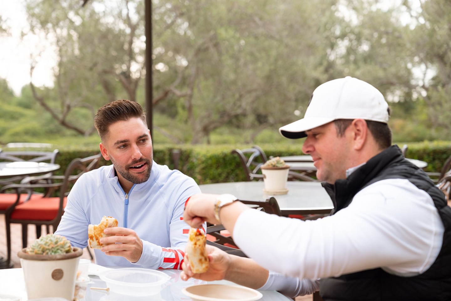 golf buddies having a burrito at cafe 2